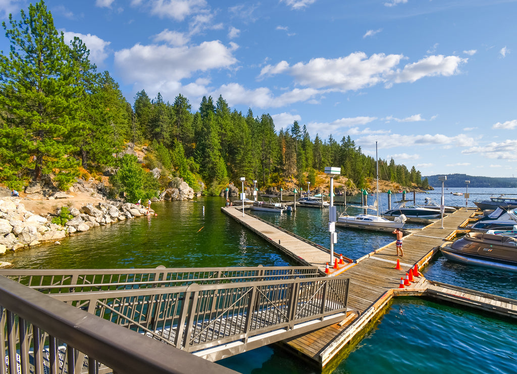 Boats, wave runners and watercraft docked at a marina along Tubbs Hill on Lake Coeur d'Alene in Coeur d'Alene, Idaho USA