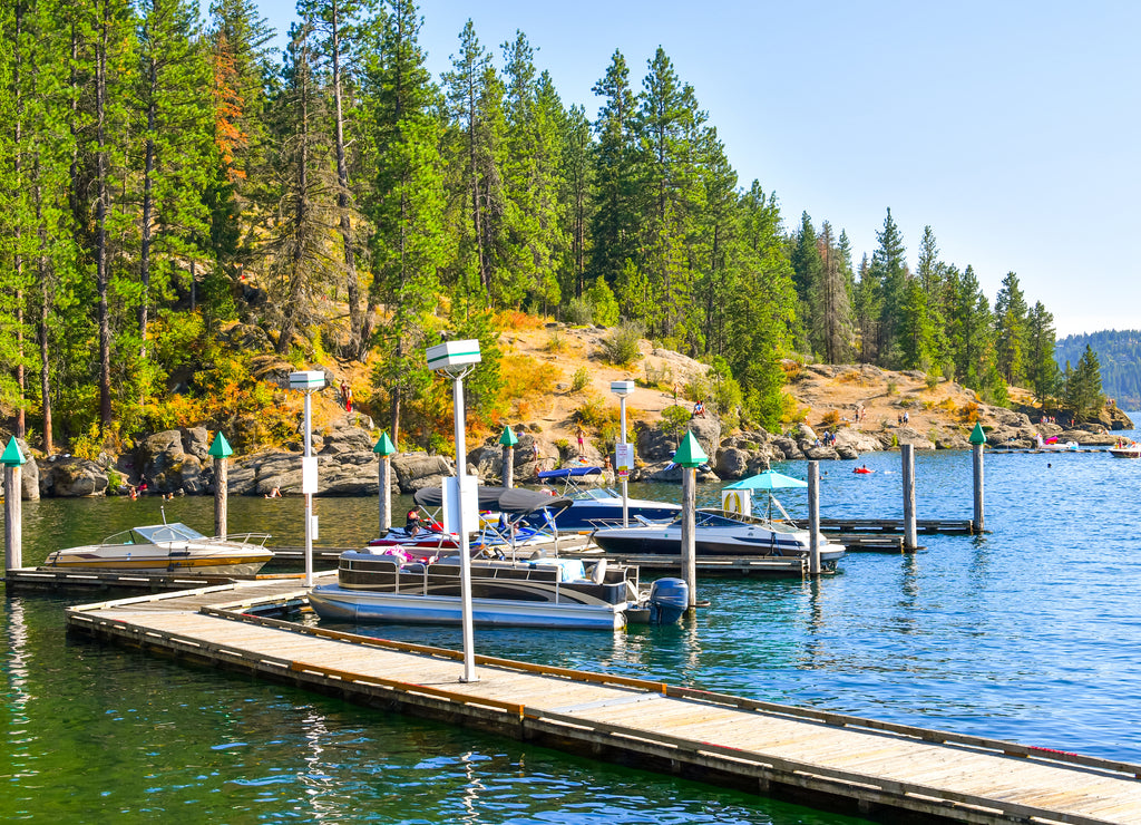 Boats, wave runners and watercraft docked at a marina along Tubbs Hill on Lake Coeur d'Alene in Coeur d'Alene, Idaho USA