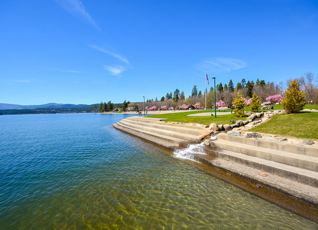 The city beach, steps and lake at Independence Point in the downtown area of Coeur d'Alene, Idaho USA at spring