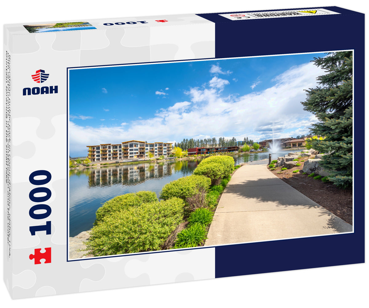 Riverstone public park in Coeur d'Alene, Idaho, USA, with restaurants, new construction and the water fountain spraying in the small lake