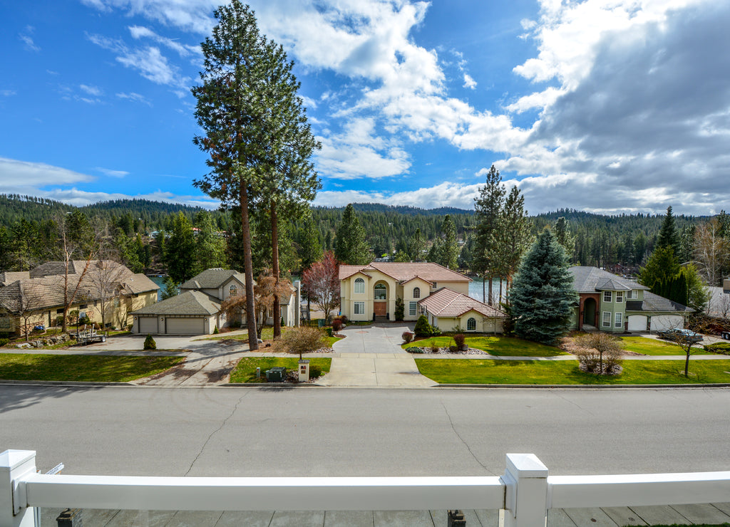 View from the balcony of a luxury home of the Spokane River, mountains and upscale homes in Post Falls, Idaho, USA