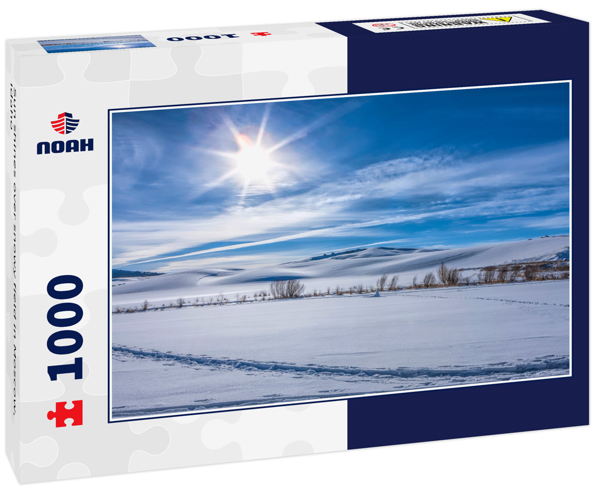 Sun shines over snowy field in Moscow, Idaho