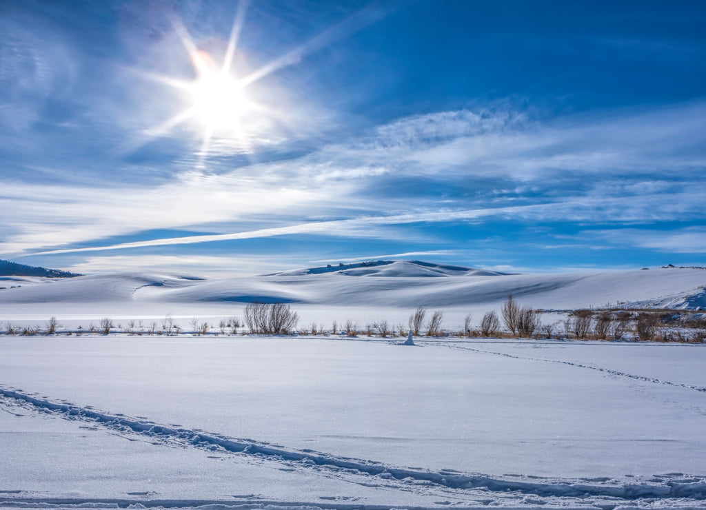 Sun shines over snowy field in Moscow, Idaho