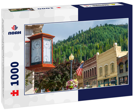 An antique clock showing time and temperature on the corner of a vintage building in the historic mining town of Wallace, Idaho, USA