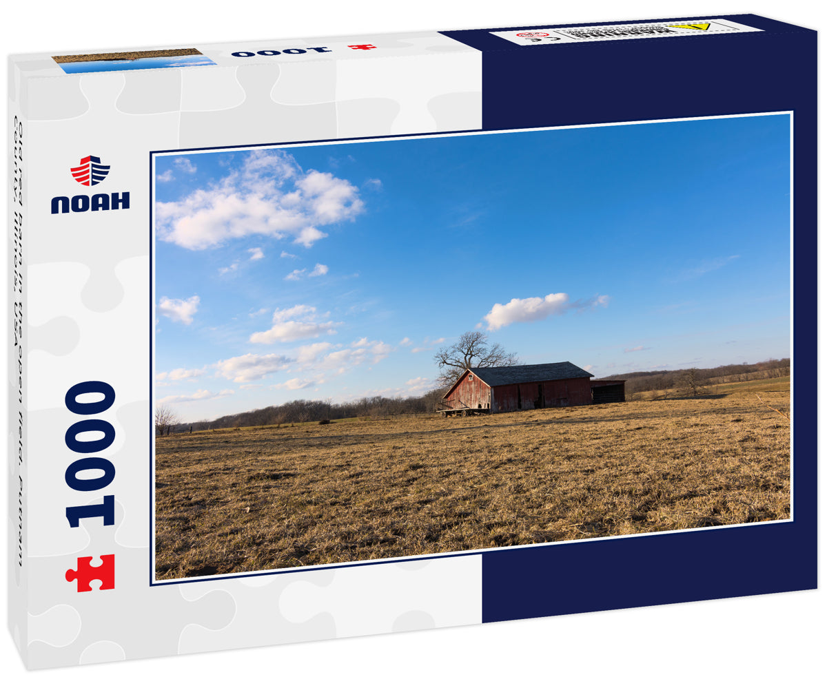 Old red barn in the open field. Putnam County, Illinois, USA