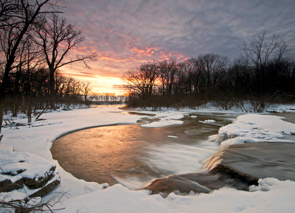 A winter sunset on a waterfall on Prairie Creek. Will County, Illinois, USA