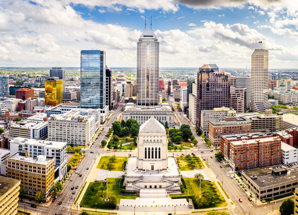 Aerial view of Indianapolis, Indiana skyline above Indiana World War Memorial and University park, and along Meridian and Pennsylvania streets