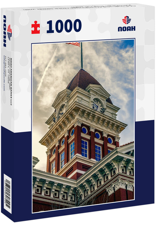 Old Indiana courthouse clock tower with American flag on pole