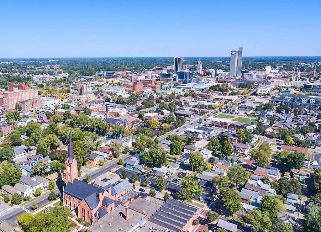 Aerial of Fort Wayne, Indiana with church in front and downtown in background