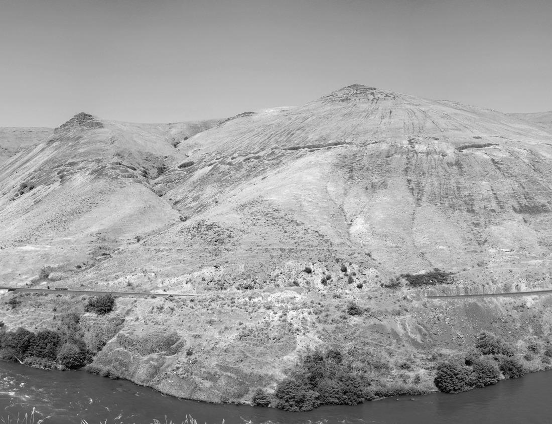 Noah Jigsaw Puzzle Aerial view of the coast with blue ocean water and houses along the sand at the beach, cars driving on the road and blue sky with clouds in Huntington Beach California USA in black white 1000 pieces