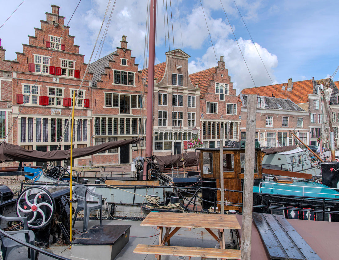 Traditional boats in the inner harbor of Hoorn in the Netherlands with the quay lined with historic buildings 1000pc Puzzle