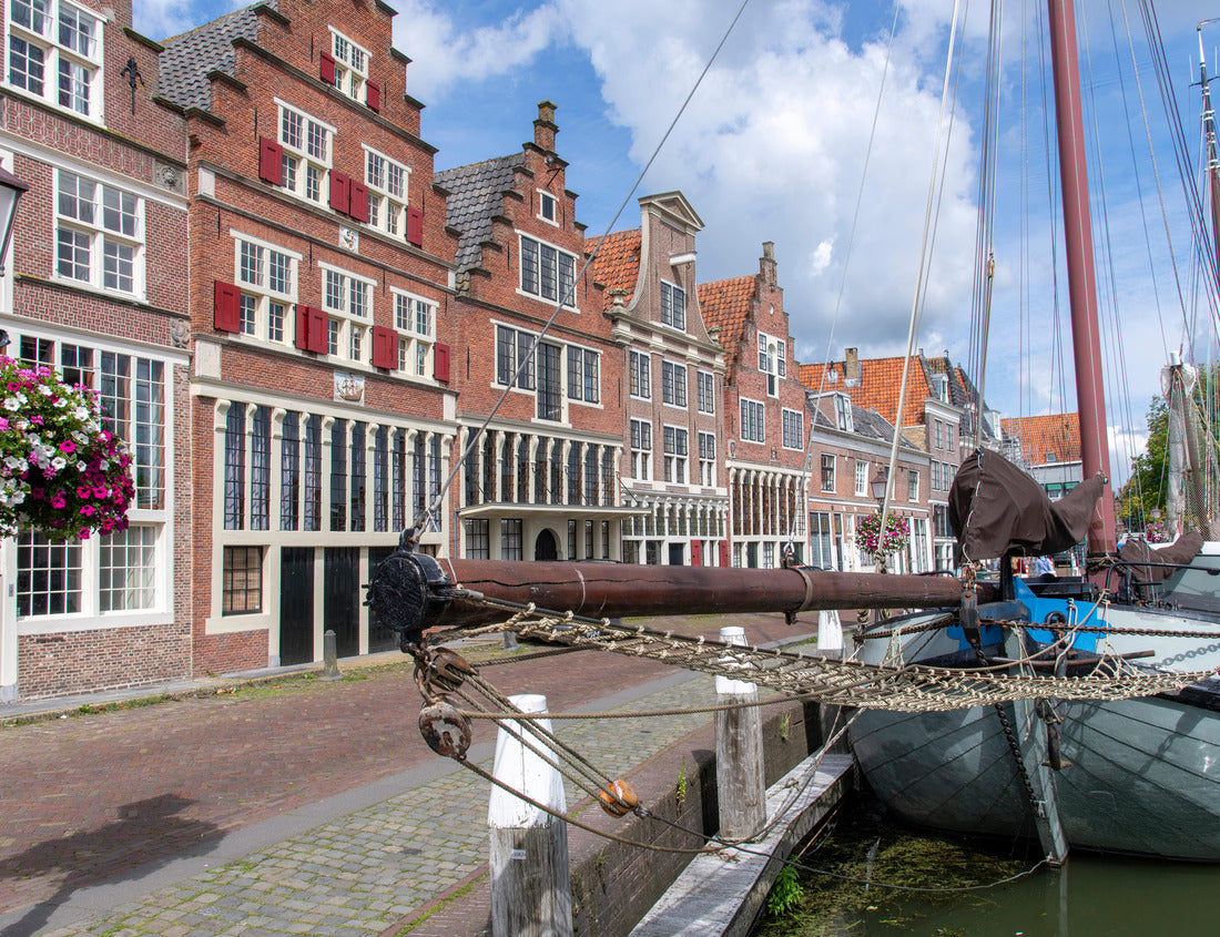Traditional boats in the inner harbor of Hoorn in the Netherlands with the quay lined with historic buildings 1000pc Puzzle