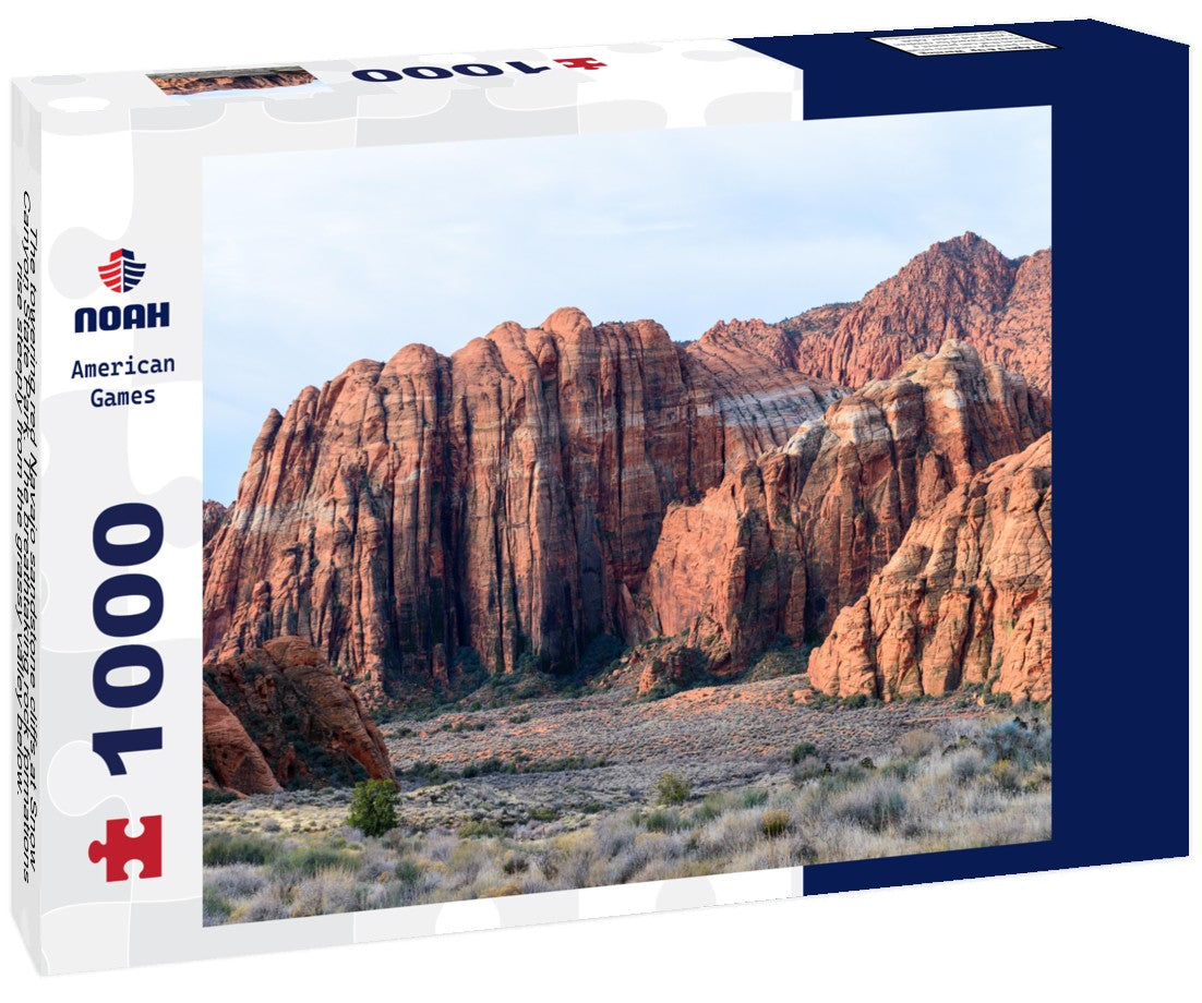 The towering red Navajo sandstone cliffs at Snow Canyon State Park. The breathtaking rock formations rise steeply from the grassy valley below. Taken in the early morning light - St George, Utah, USA 1000pc Puzzle