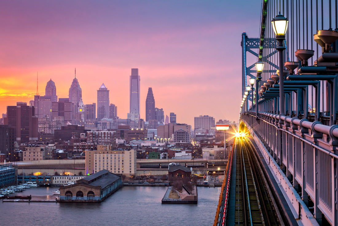 Noah Jigsaw Puzzle Philadelphia under a bright purple sunset. An arriving train crosses the Ben Franklin Bridge 2000 pieces