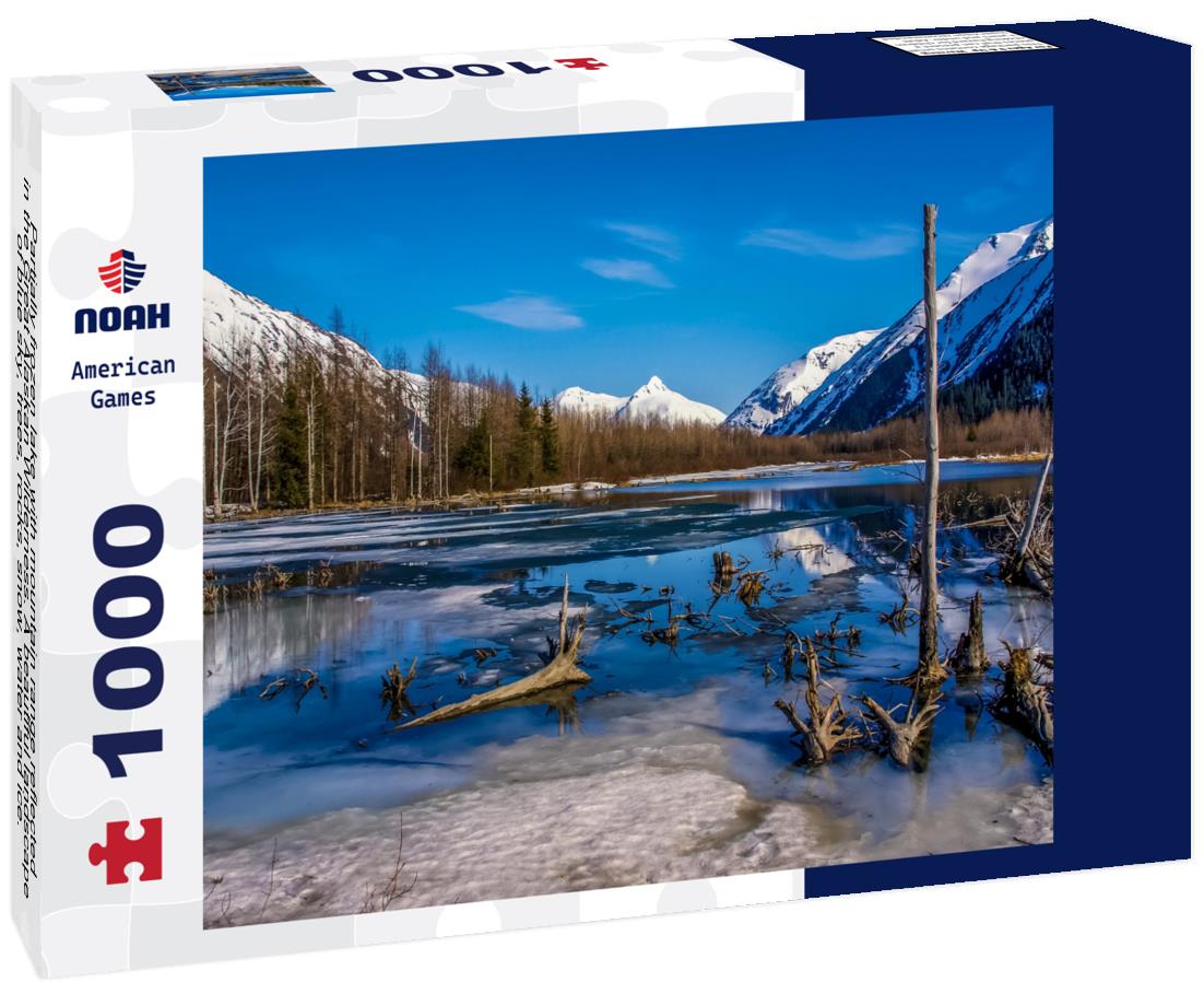 Noah Jigsaw Puzzle Partially frozen lake with mountain range reflected in the Great Alaskan Wilderness. A beautiful landscape of blue sky, trees, rocks, snow, water and ice. Near the Seward highway near Anchorage, Alaska 1000 Pieces