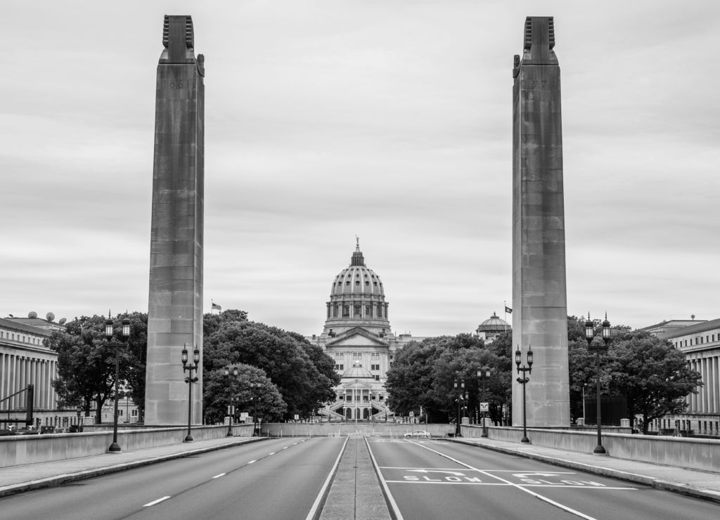 Capitol building in harrisburg, pennsylvania from the soilders and sailors memorial buildings in black white