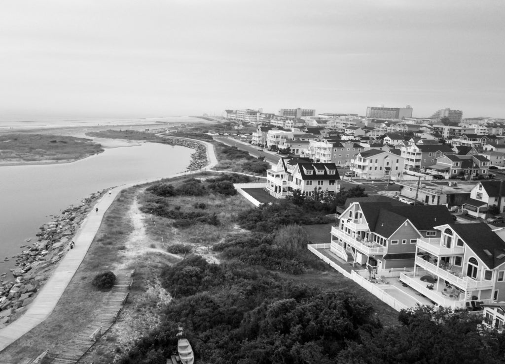 Aerial view of the sunset over North Wildwood sea wall, New Jersey in black white