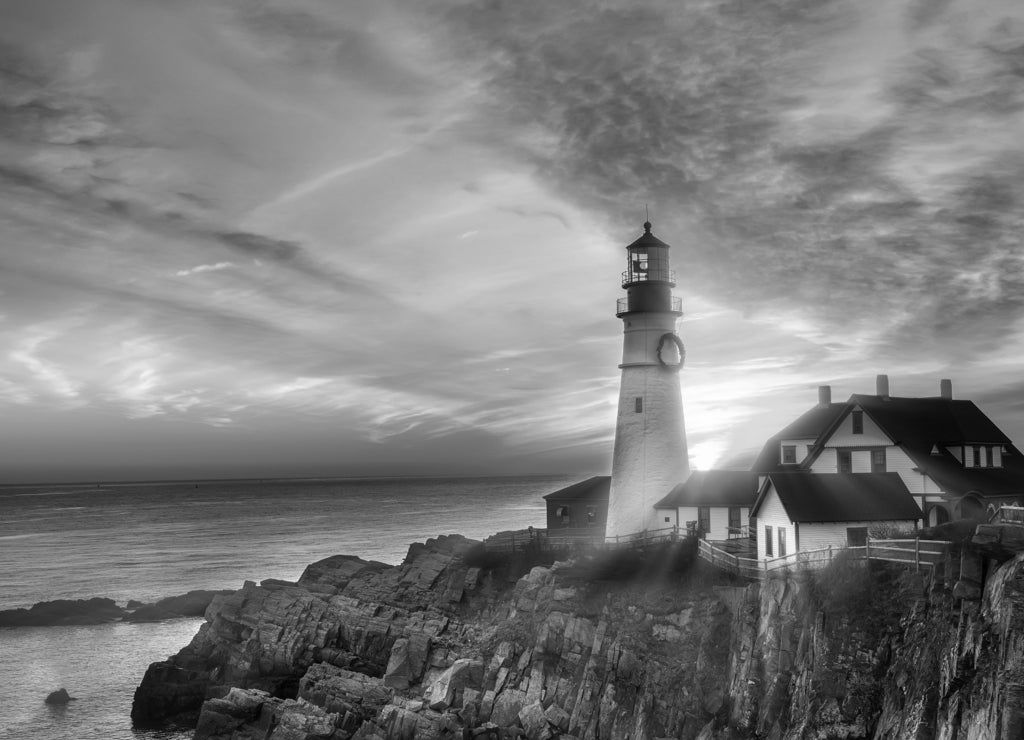 Lighthouse on the beach at dawn, Portland Head Light, Maine in black white