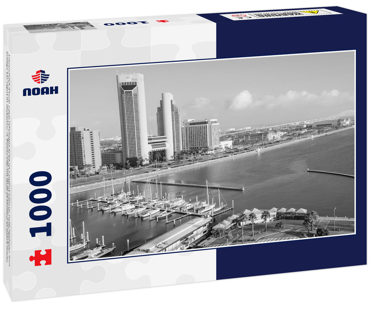 Panorama aerial view Bayfront area of Corpus Christi with skylines and marina piers row of boat, sailboat and yacht at sunrise. City harbor bridge far right in distance. A Texas city on Gulf of Mexico in black white