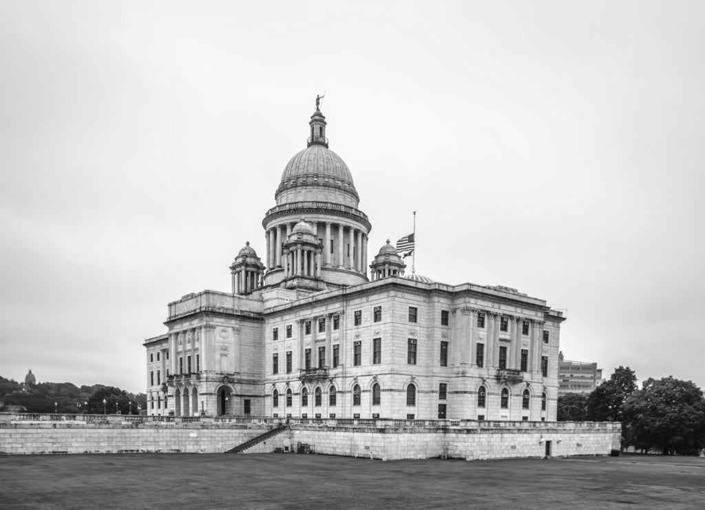 Rhode Island state capitol building on cloudy day in black white