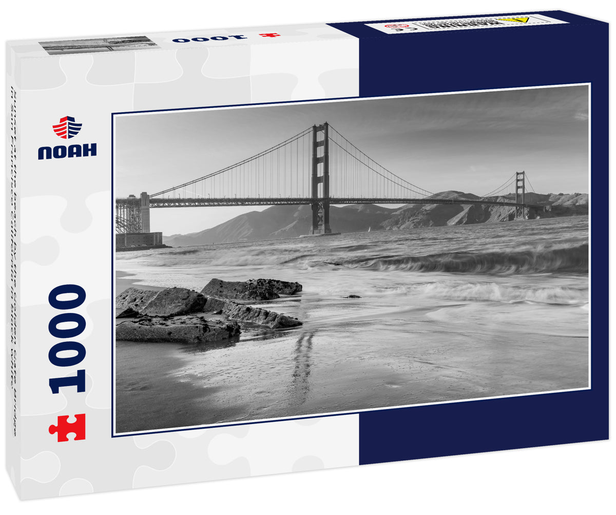 Sunset at the beach by the Golden Gate Bridge in San Francisco California in black white