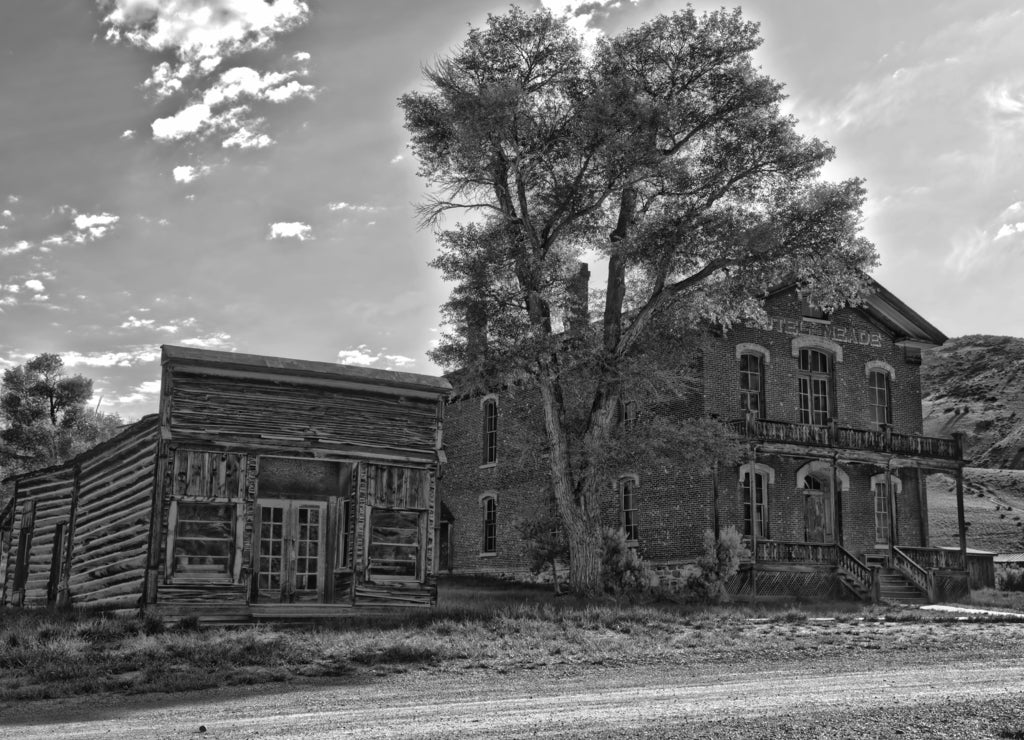 Brick hotel and store in Bannack, Montana a restored abandoned mining town in black white