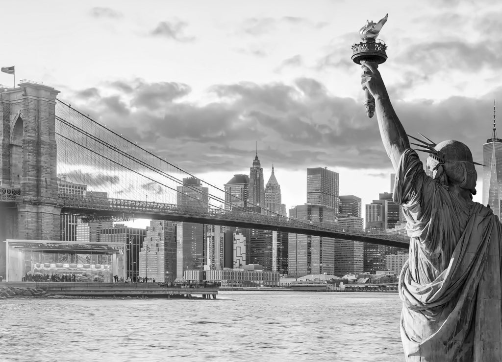 Statue Liberty and New York city skyline at sunset in black white