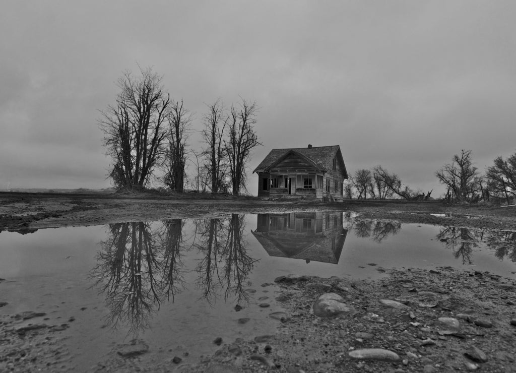 Abandoned Pioneer House on stormy day, Nampa, Idaho in black white