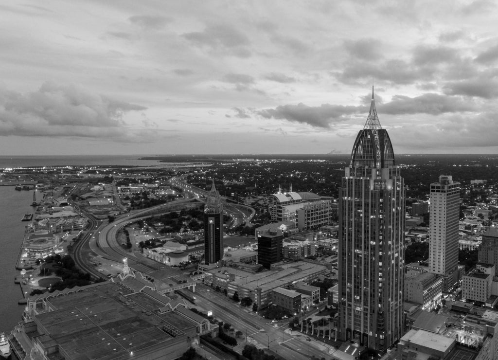 Aerial view of downtown Mobile, Alabama riverside at sunset in black white