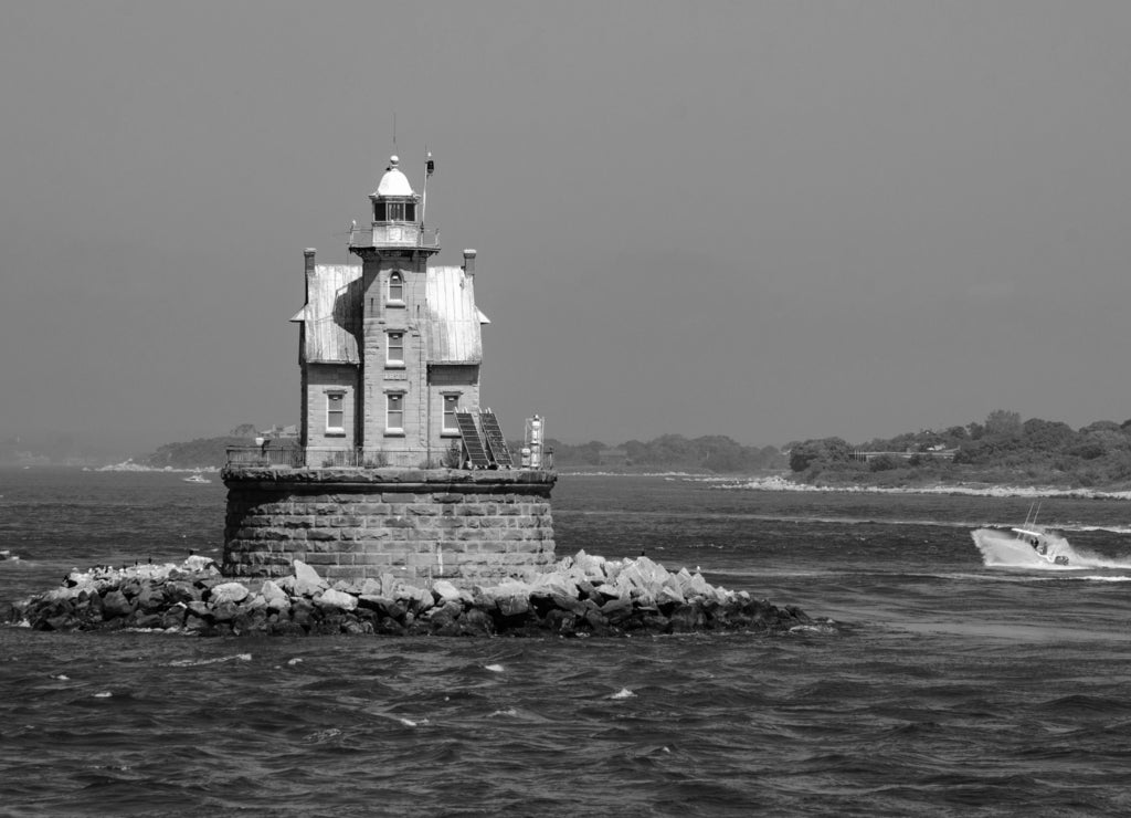 Race Rock Light is a lighthouse on Race Rock Reef, a dangerous set of rocks on Long Island Sound southwest of Fishers Island, New York and the site of many shipwrecks, Connecticut in black white