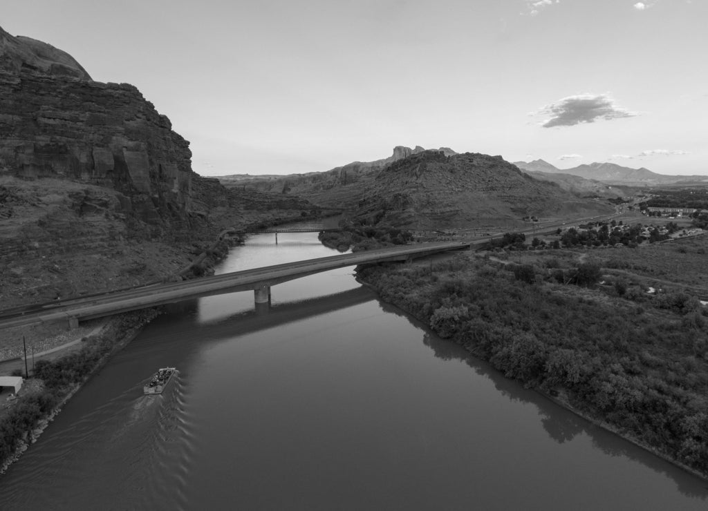 Aerial view of Colorado River and La Sal Mountains near Arches National Park at sunset in Moab, Utah, USA in black white