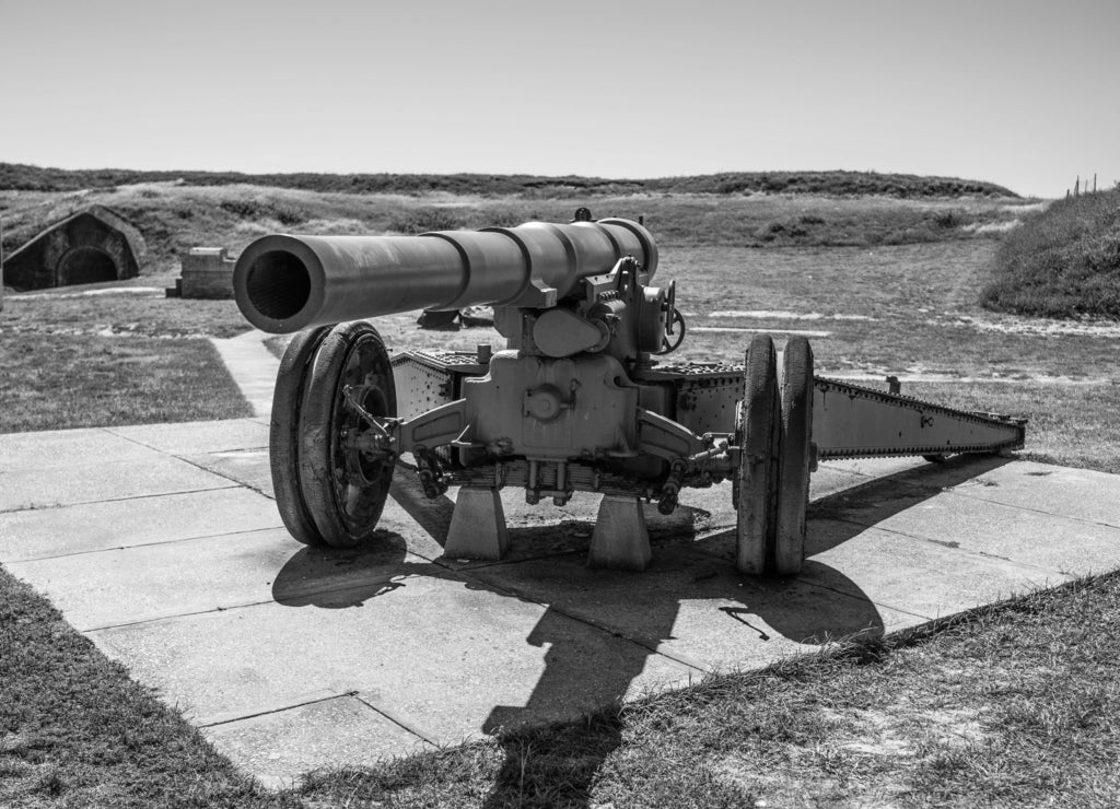 Artillery cannon located outside of historic Fort Morgan, Gulf Shores Alabama, USA in black white