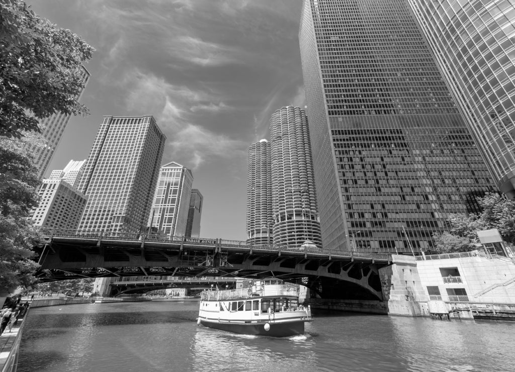 Chicago downtown and Chicago River with bridge and with tourist ship during sunny day, Chicago, Illinois in black white