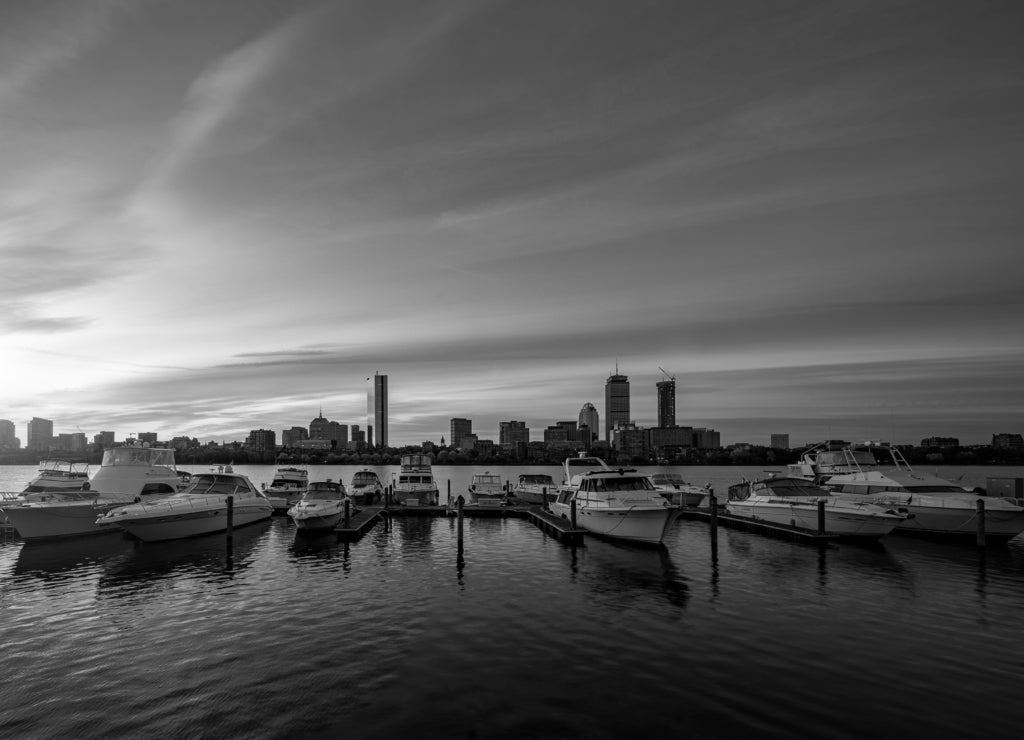 Sunrise over Boston city with boat and harbor, Massachusetts cityscape in black white