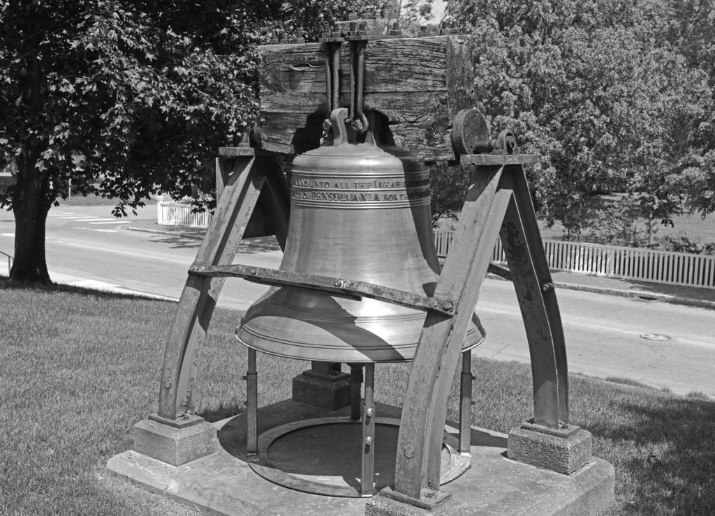 Liberty Bell in front of Maine State House. This building is the state capitol of the State of Maine in Augusta, Maine, USA. Maine State House was built in 1832 with Greek Revival style in black white