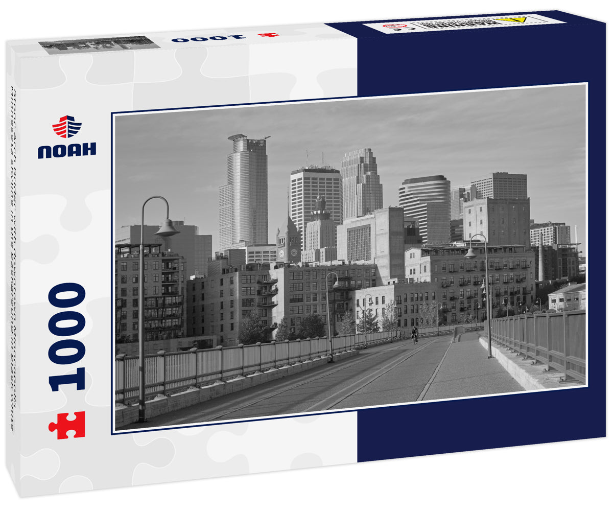 Stone Arch Bridge with downtown Minneapolis Minnesota skyline in the background in black white