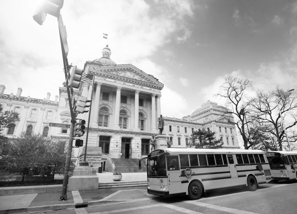 Bus stop in front of Indiana Statehouse building in black white