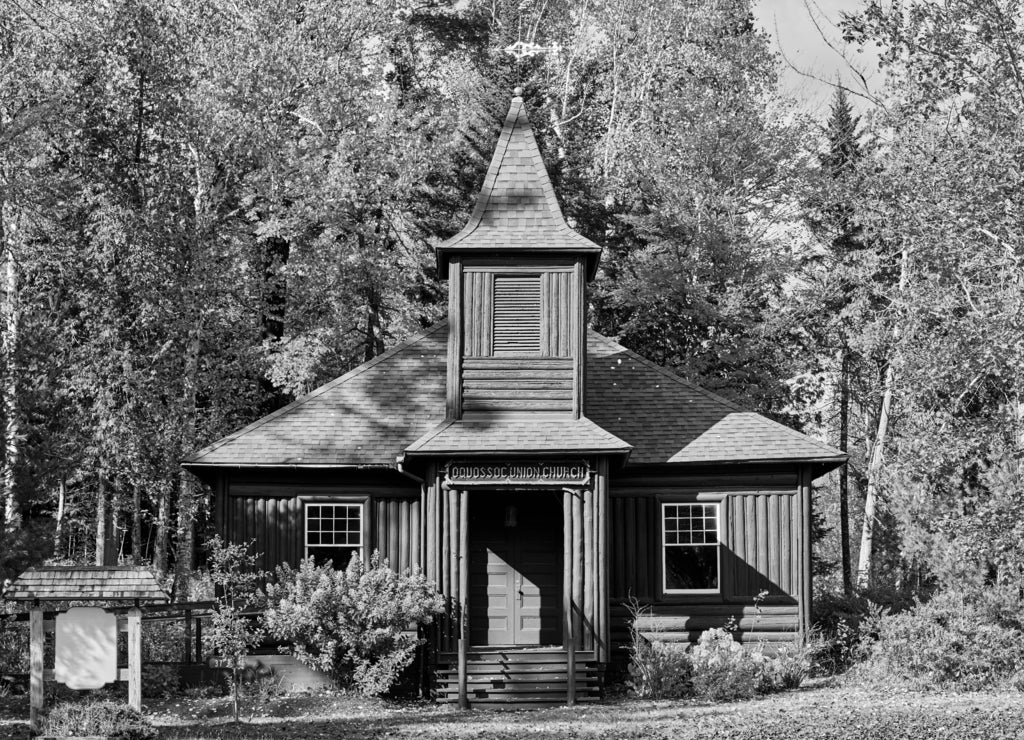Very old log church at autumn. Oquossoc, Maine, USA in black white