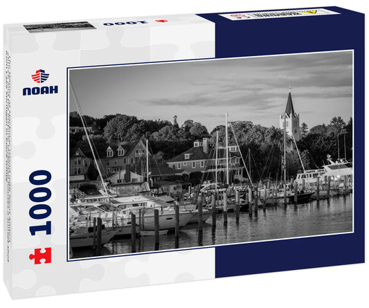 The Marina at Mackinac Island with Saint Anne's church and the historic Victorian houses a sunset shot from Lake Michigan in black white