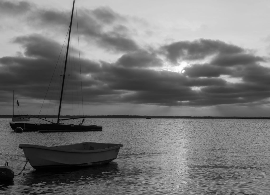 Beautiful sunset over Lavallette, New Jersey featuring dramatic sky on the background and Lavallette bay on the foreground in black white