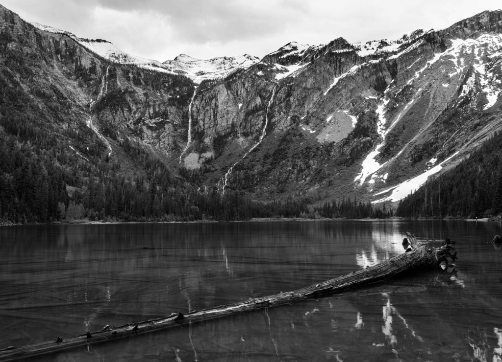 Waterfalls on the rim of Avalanche lake, Glacier National Park Montana in black white