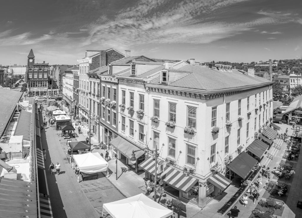 Aerial view of colorful houses at Findlay market in the re-gentrified, up and coming neighborhood Over the Rhine in Cincinnati Ohio USA with street vendors on a sunny summer morning in black white