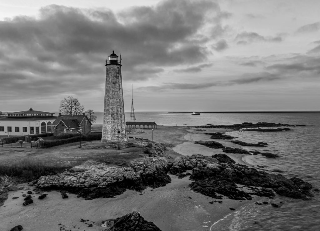 Lighthouse and Oyster Boat at Sunrise on New Haven Harbor, Connecticut in black white