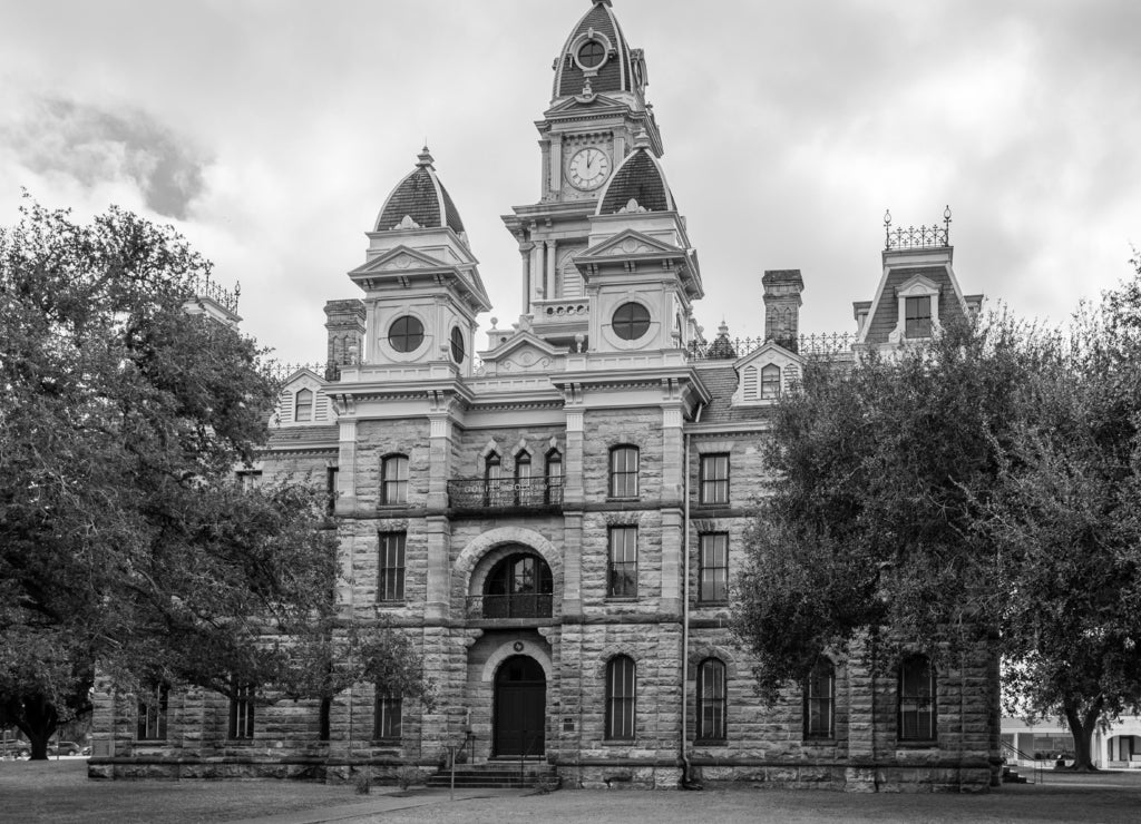 Built in 1894 of local, rough-cut limestone, the Goliad County (Texas) Courthouse is still in active use today in black white