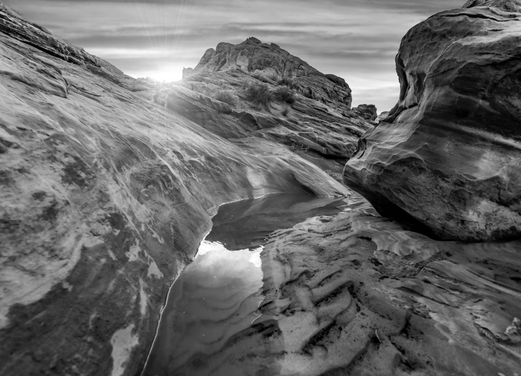 The mesmerizing red rock layers and formations of the desert landscape at the Valley of Fire State Park near Las Vegas, Nevada USA in black white
