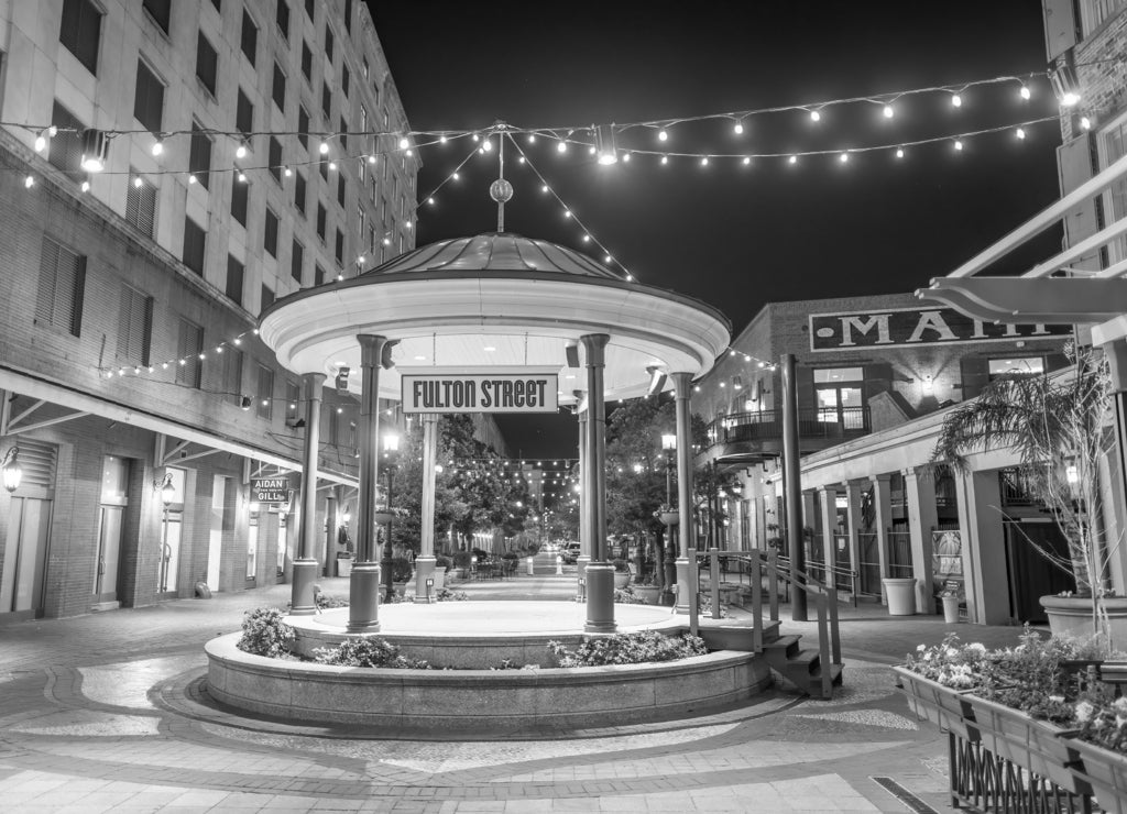 New Orleans, Louisiana: Famous Fulton Street at night in black white