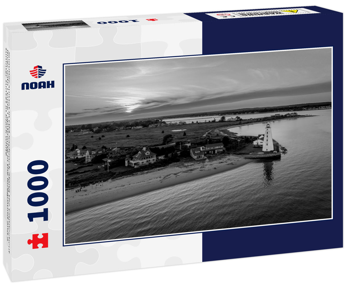 Summer sunset in Old Saybrook along the Connecticut River with Lynde Lighthouse in the foreground and a summer sunset in black white