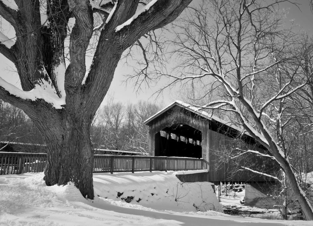 Wintertime at the historic Ada Covered Bridge in Kent County, Michigan in black white