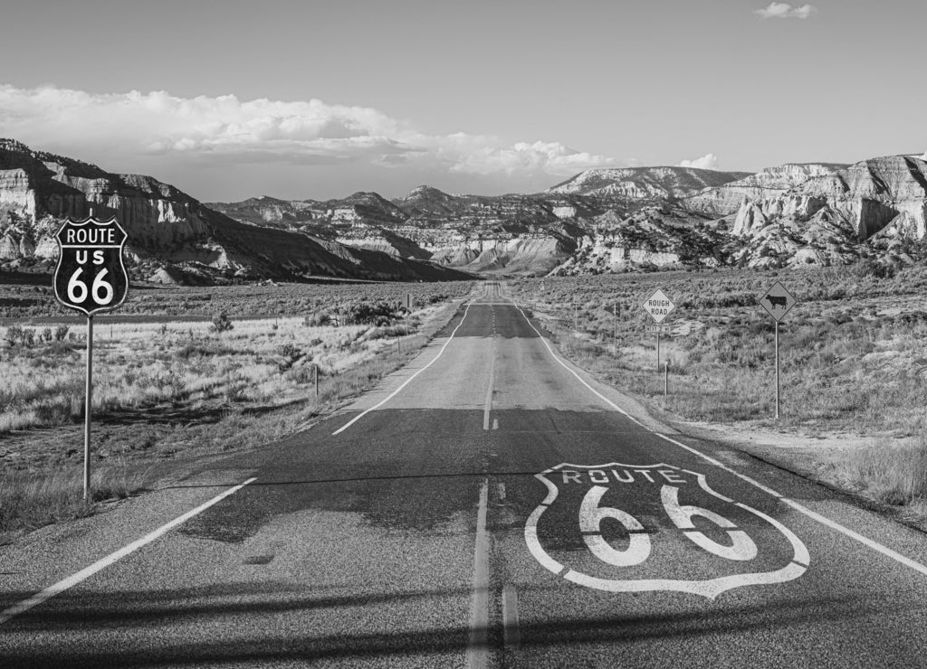 Scenic view of famous Route 66 in classic american mountain scenery at sunset in black white