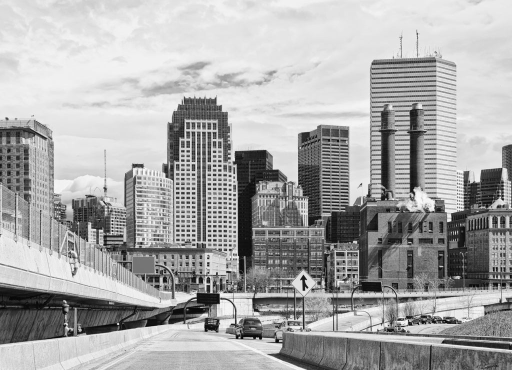 Skyline of skyscrapers and Boston road with car traffic in black white